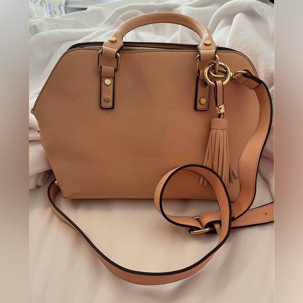 Elegant light pink with gold accents handbag